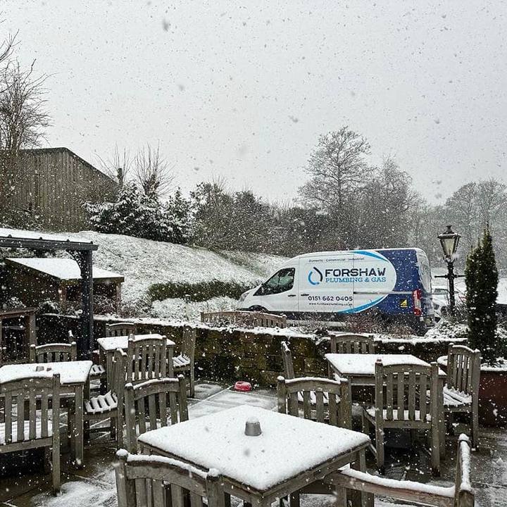 The large Forshaw van parked outside a pub in the snow